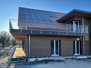 Fertighaus Mehrfamilienhaus mit sieben Wohneinheiten von Frammelsberger Holzbau - Mehrfamilienhäuser, Außenansicht 3