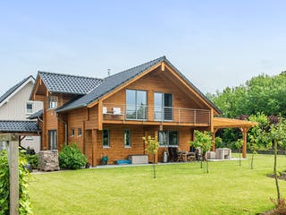 Blockhaus Münsterland von Fullwood Wohnblockhaus Ausbauhaus ab 260000€, Blockhaus Außenansicht 4