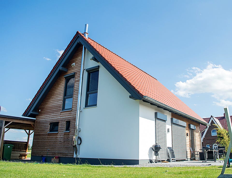 Fertighaus Kompaktes Einfamilienhaus für Kostenbewusste von Hausbau Heggemann Schlüsselfertig ab 350000€, Außenansicht 3