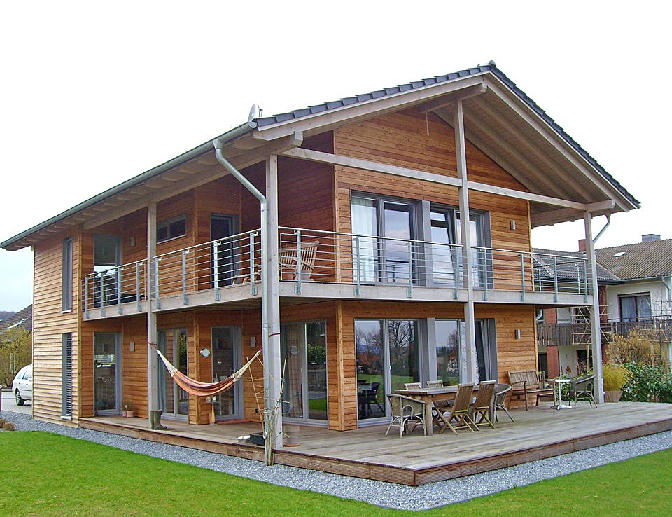 Fertighaus Holzhaus mit architektonischem Kunstgriff von Hausbau Heggemann Schlüsselfertig ab 500000€, Außenansicht 1