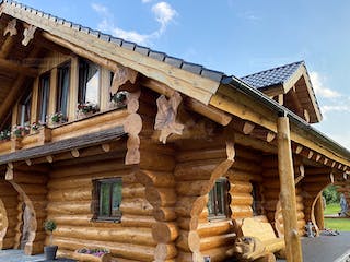 Blockhaus Blockhaus Montreal von Holzbau rustikal - Blockhäuser Bausatzhaus ab 211680€, Satteldach-Klassiker Außenansicht 3