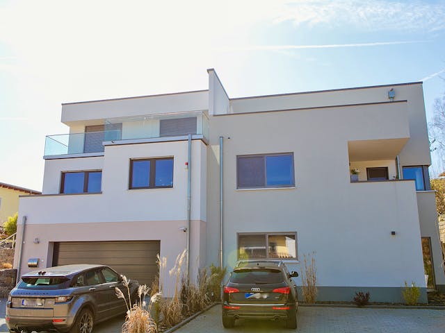 Massivhaus Flachdachhaus am Hang von Massivhaus Rhein Lahn, Cubushaus Außenansicht 1 Massivhaus Flachdachhaus am Hang von Massivhaus Rhein Lahn, Cubushaus Außenansicht 1