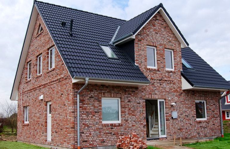 Massivhaus Friesenhaus V140 von Virtus Projektbau Schlüsselfertig ab 152500€, Außenansicht 1
