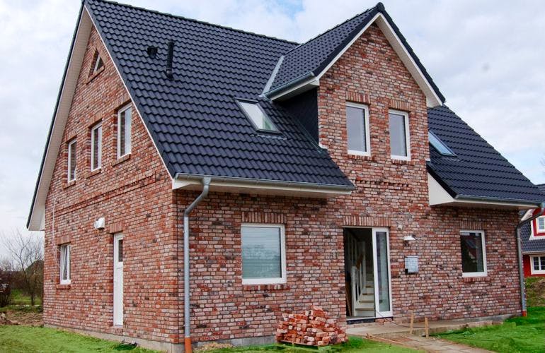 Massivhaus Friesenhaus V150 von Virtus Projektbau Schlüsselfertig ab 157900€, Außenansicht 1