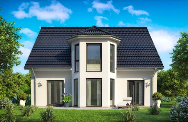 Das sechseckige Zwerchdach über einem turmartigen Trapezerker von Rostow Massivhaus hebt sich attraktiv vom einfachen Satteldach ab