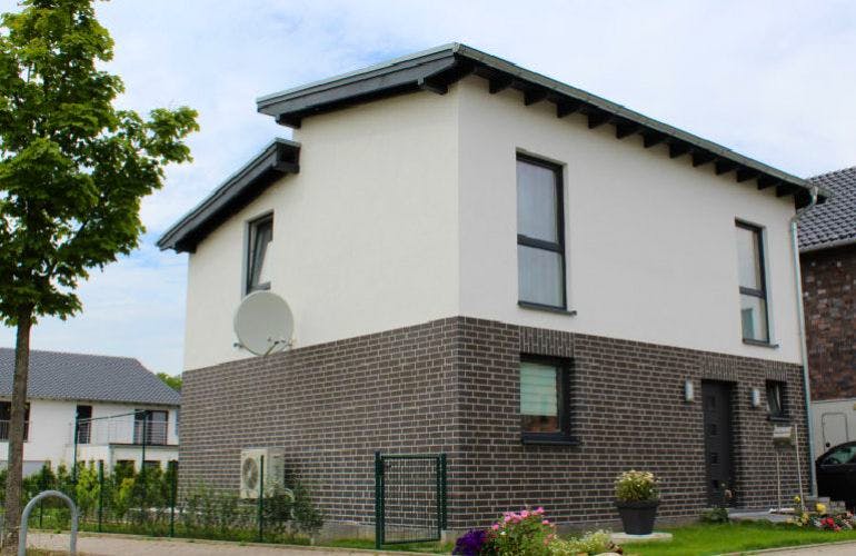 Massivhaus Vario 1.2 ID-Massivhaus von CASA Haus Ausbauhaus ab 99850€, Außenansicht 1
